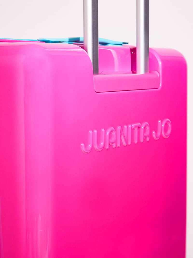 Valija fucsia de 23 kilos